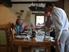 Richard serving the wine... Sue serving her home-grown tomato and basil soup (99kb)